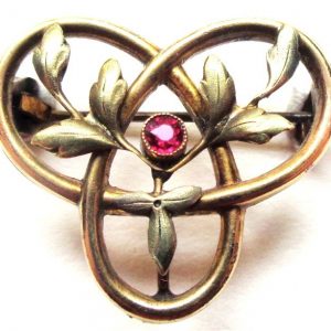 French antique art nouveau goldfilled brooch with ruby - triple mobius