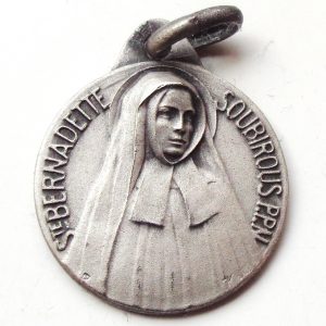 Vintage silver religious charm medal pendant to Saint Bernadette Soubirous