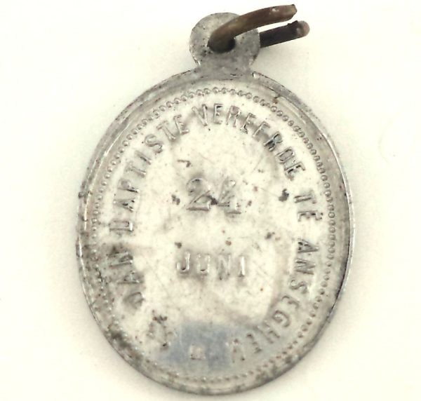 Reverse side of vintage Saint John the Baptist medal with Dutch inscription.