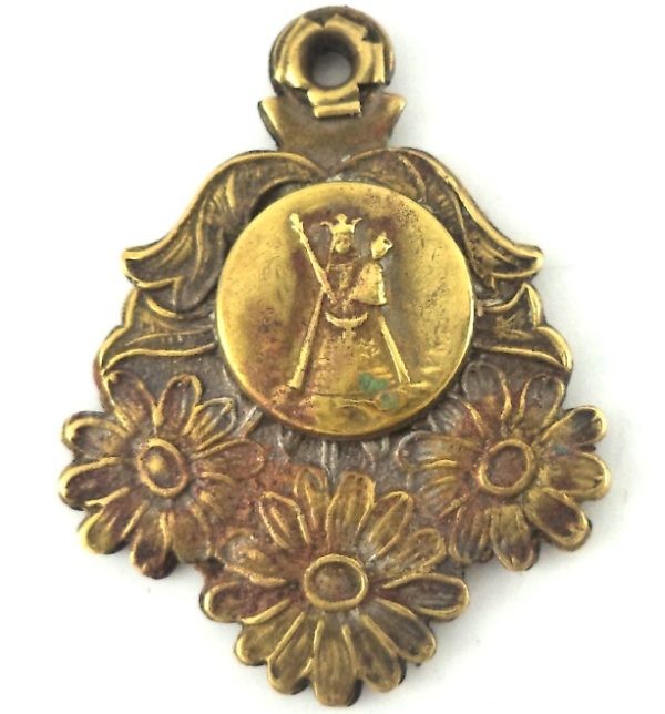 Vintage triple sliding pendant of Our Lady with intricate floral design and brass detailing.