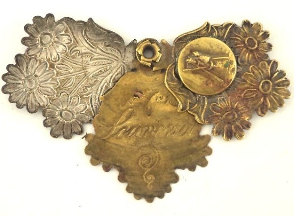 Vintage triple sliding pendant of Our Lady with intricate floral design and brass detailing.