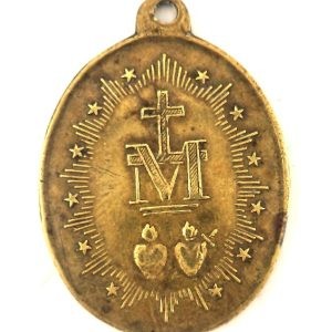 Reverse of the antique bronze Miraculous Medal featuring Marian symbol and Sacred Hearts.