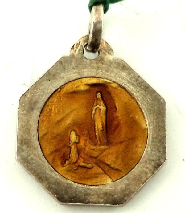 Reverse side of the silver art deco medal showing the apparition of Our Lady of Lourdes to Saint Bernadette