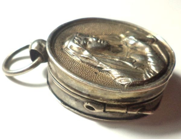 Antique silver locket reliquary containing a relic of Saint Mary Magdalene.