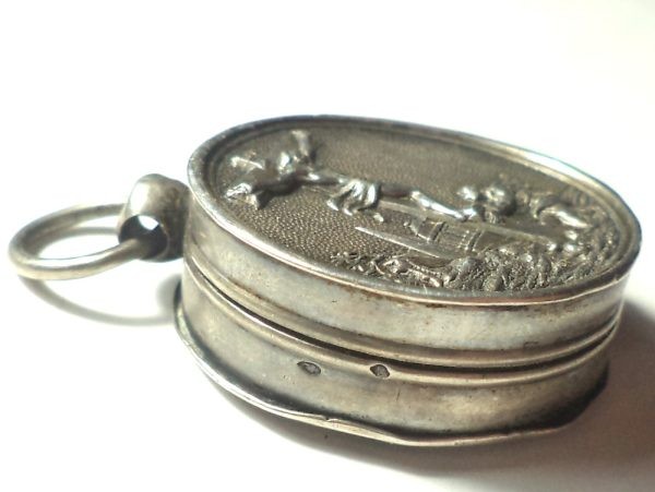 Antique silver locket reliquary containing a relic of Saint Mary Magdalene.