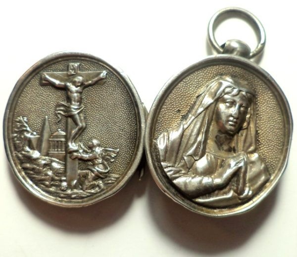 Antique silver locket reliquary containing a relic of Saint Mary Magdalene.