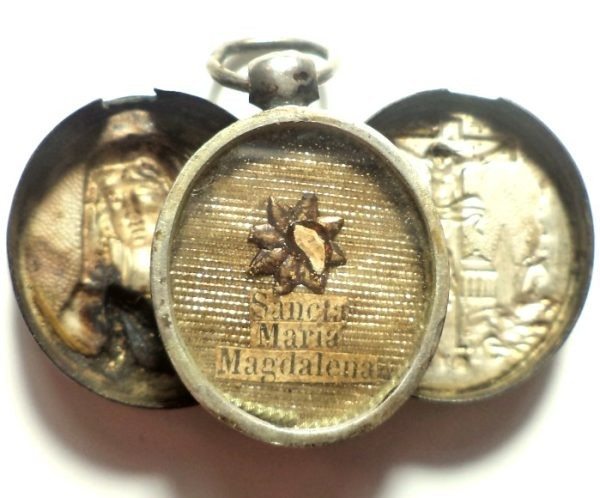 Antique silver locket reliquary containing a relic of Saint Mary Magdalene.