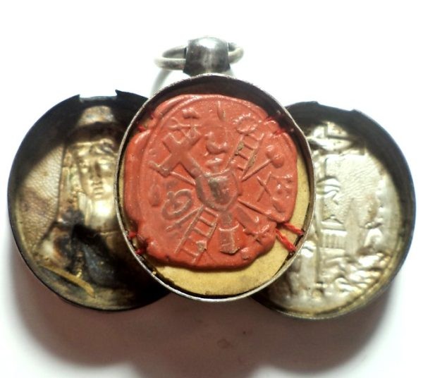 Antique silver locket reliquary containing a relic of Saint Mary Magdalene.