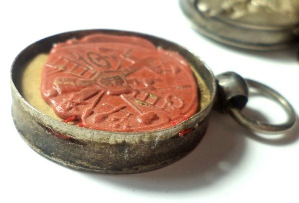 Antique silver locket reliquary containing a relic of Saint Mary Magdalene.