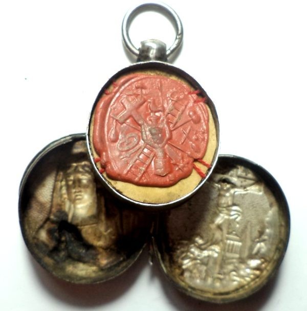 Antique silver locket reliquary containing a relic of Saint Mary Magdalene.