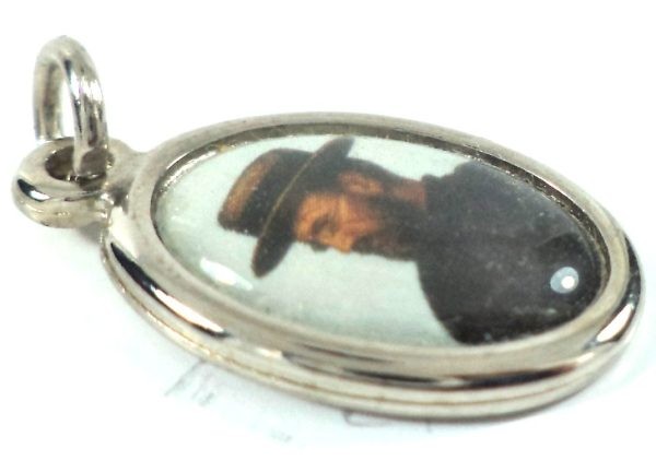 Portrait of Saint Damian of Molokai on a silver-toned vintage medal pendant.