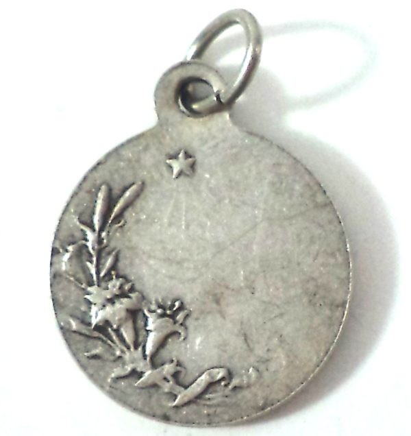 Reverse side of Saint Christopher medal pendant, silver-plated, featuring lilies and a star