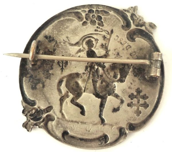 Back view of antique silver-plated Saint Joan of Arc Art Nouveau brooch with pinback.