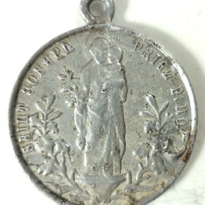 Antique medal of Saint Joseph with the Child Jesus, inscription "Saint Joseph priez pour nous"