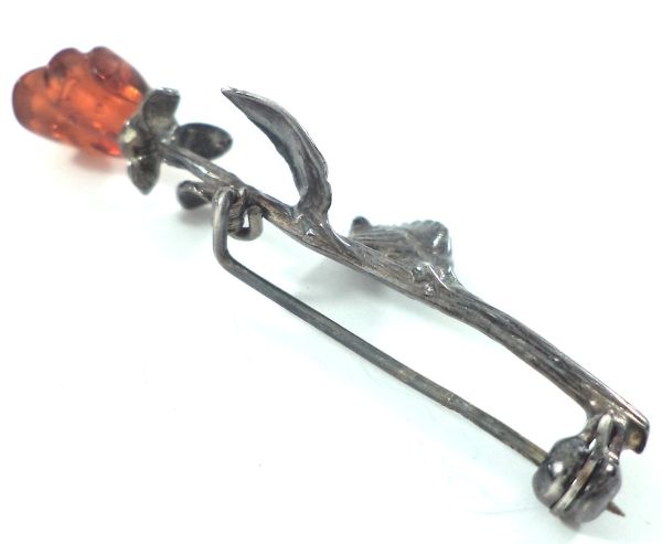 Antique silver and amber rose brooch with carved amber rosebud