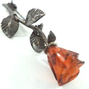 Antique silver and amber rose brooch with carved amber rosebud