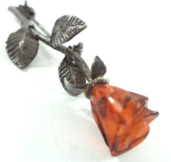 Antique silver and amber rose brooch with carved amber rosebud