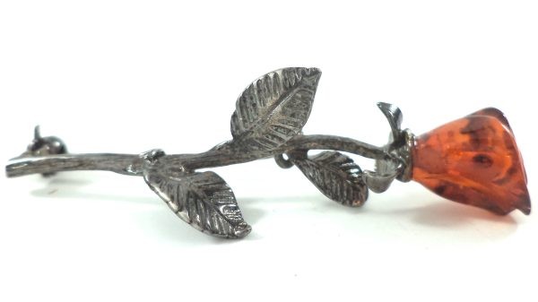 Antique silver and amber rose brooch with carved amber rosebud