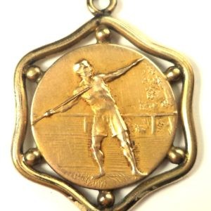 Antique gold-plated medal pendant featuring an athlete in action and a laurel wreath, 25 mm diameter