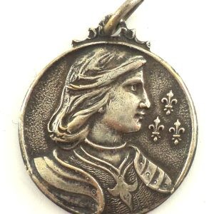 Antique silver-plated Saint Joan of Arc medal featuring the French saint in profile with fleur-de-lis.