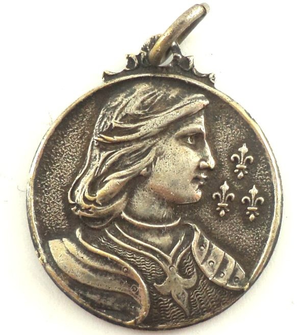 Antique silver-plated Saint Joan of Arc medal featuring the French saint in profile with fleur-de-lis.