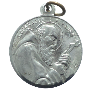 Antique Saint Conrad Parzham Medal in aluminium with engravings of Saint Conrad and the Virgin Mary.