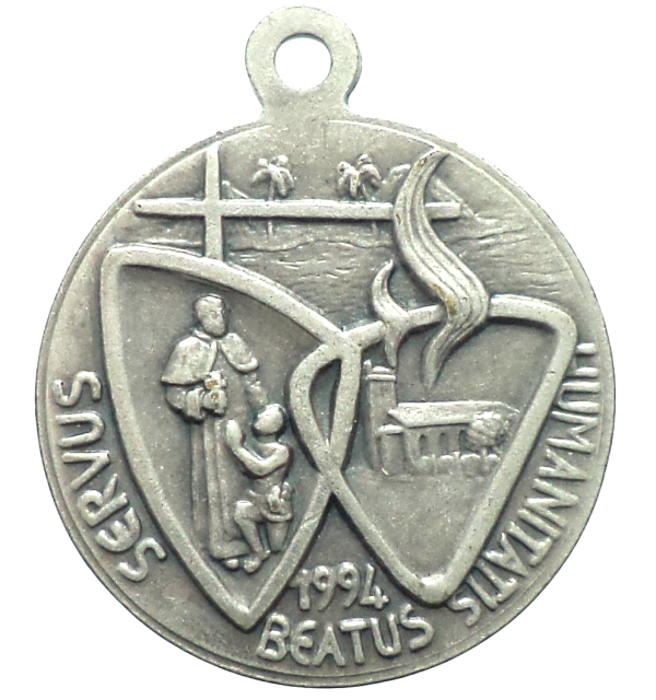 Vintage silverplated Saint Damian of Molokai medal with portrait and symbolic reverse design, 18 mm diameter.