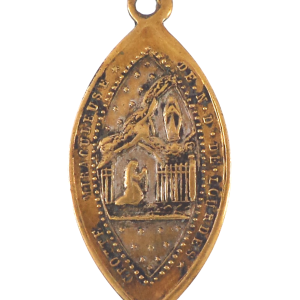 19th-century bronze medal of Our Lady of Lourdes featuring the grotto and Virgin Mary with inscriptions.